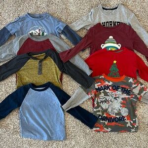 Eight toddler long-sleeve shirts.